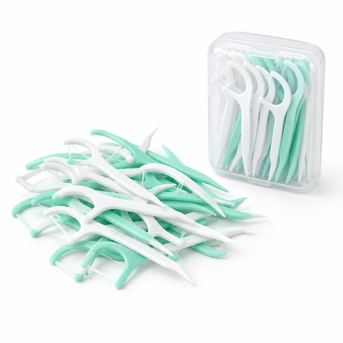 Disposable dental floss picks with travel container on a white background