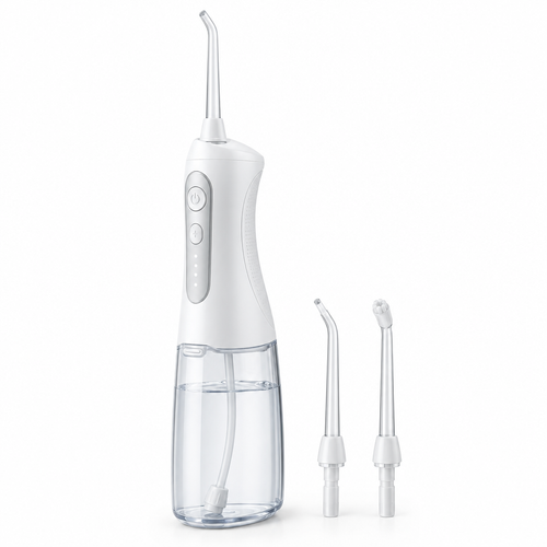 White cordless water flosser with nozzle tips on a white background